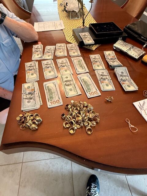 Stacks of cash next to gold rings from a buy with Marty
