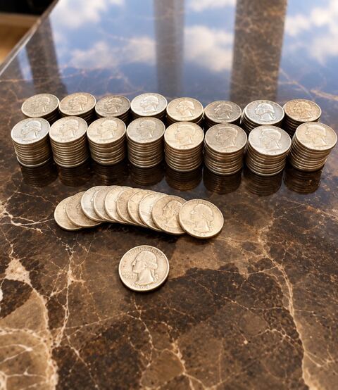 Silver U.S. coins arranged for evaluation