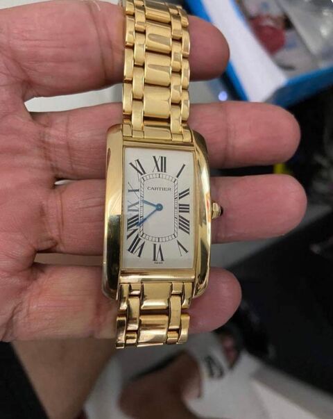 Gold Cartier Tank Américaine watch Marty buys