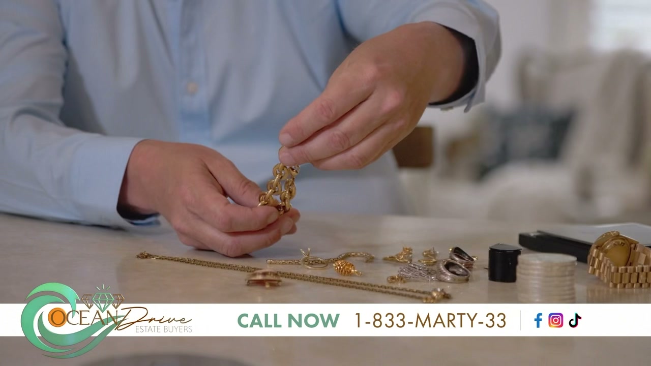 Marty evaluating gold jewelry with a scale and loupe